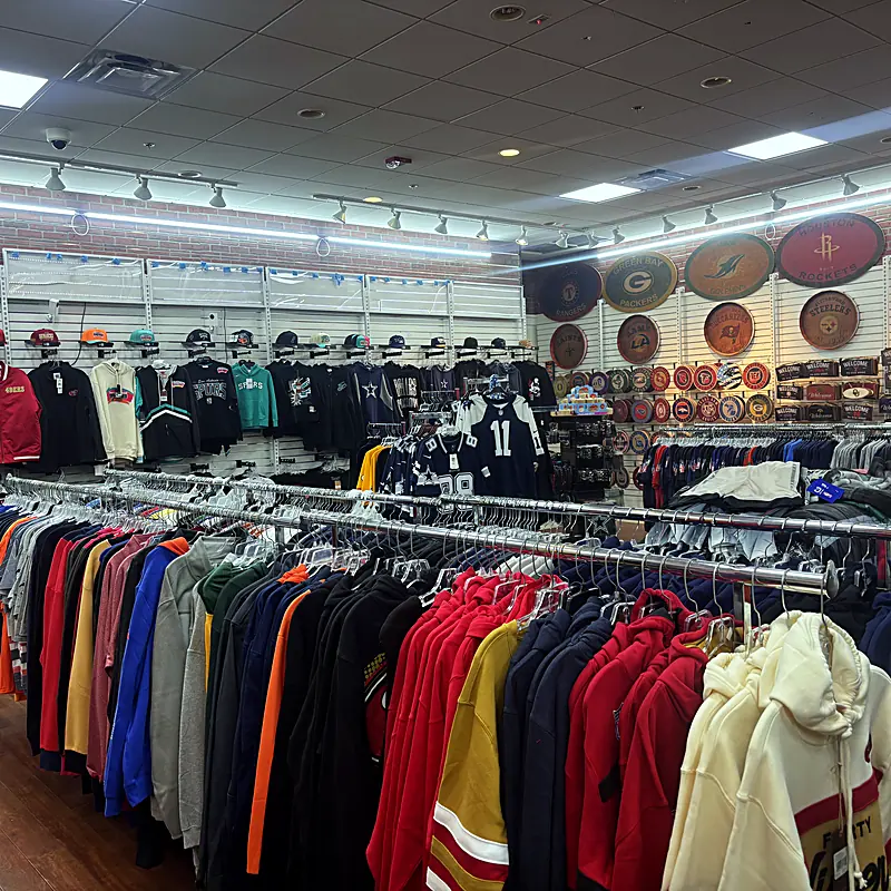Inside a Sports Zone store: jerseys, hoodies, hats and signs for teams across every league