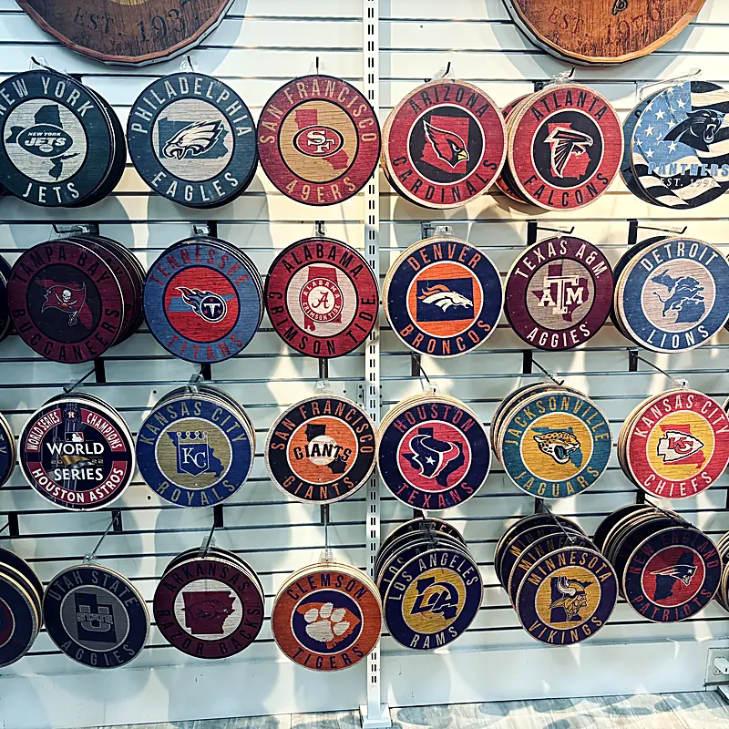 A wall of team signs at a Sports Zone store